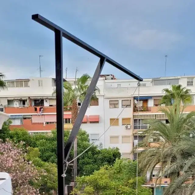 Construir una polea de hierro  para subir cargas a la terraza